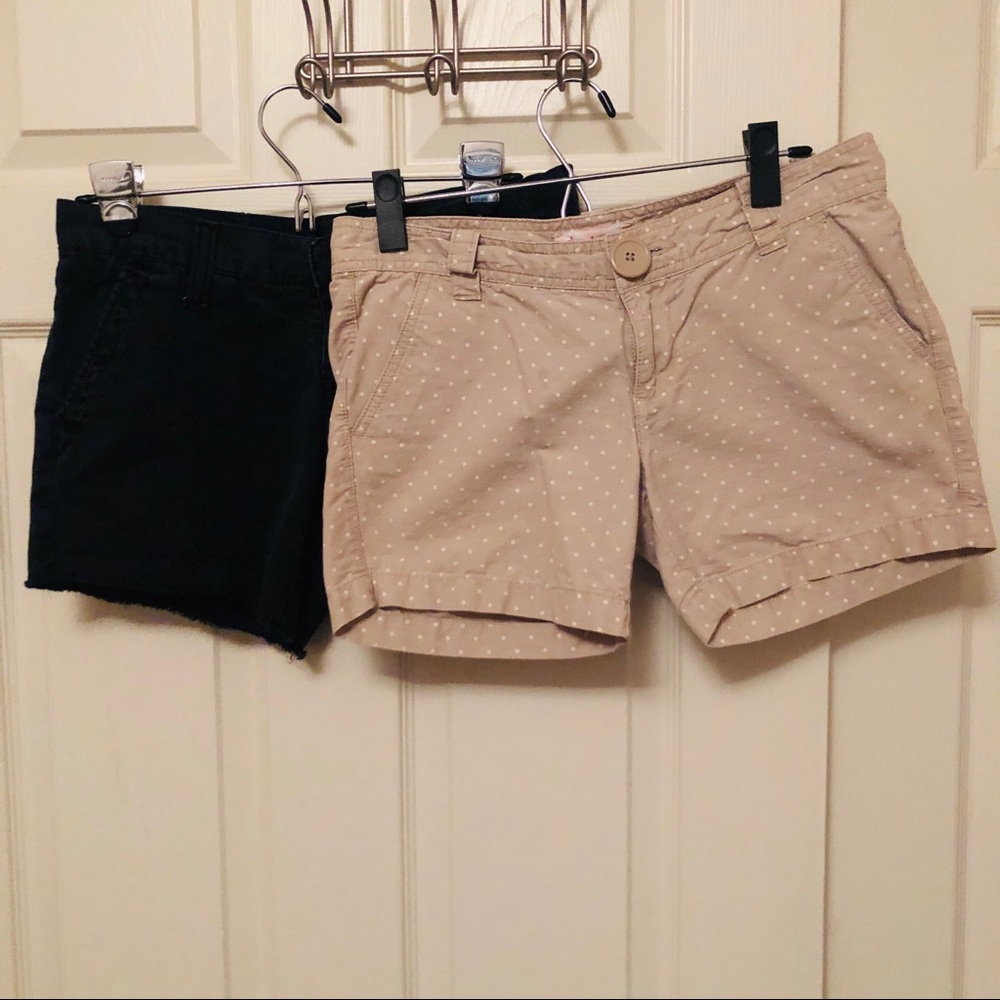 Two pairs of long shorts, light khaki and black
